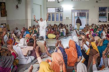 Widows praying in an Balaji ashram, Vrindavan, Mathura district, India