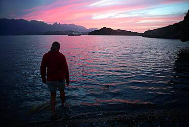 Woman in beach water at sunset, Sea of Cortez, Baja California, Mexico