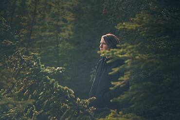 A thirty year old brunette enjoys to be in nature. Yukon Territory, Canada