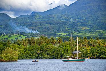 Old sailing boat in front of Tahitian coast.  Papeete Tahiti nui French Polynesia France