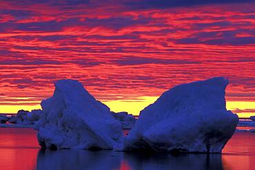 Drifting pack ice silhouette against sunset clouds reflected in Hudson Bay near Churchill Manitoba Northern Sub-arctic Canada