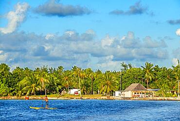 Paddle surf in the beach of Rangiroa, Tuamotu Islands, French Polynesia, South Pacific.