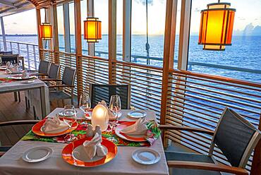 Restaurant in the luxury Paul Gauguin cruise, Society Islands, Tuamotus Archipelago, French Polynesia, South Pacific.