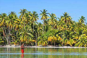 Island of Taha'a, French Polynesia. A local boy plays the ukulele to woo your girl at the Motu Mahana, Taha'a, Society Islands, French Polynesia, South Pacific.