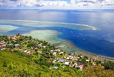 Typical houses, road, and reef see, Moorea island (aerial view), Windward Islands, Society Islands, French Polynesia, Pacific Ocean.