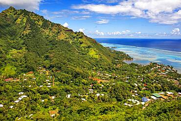 Typical houses, road, and reef see, Moorea island (aerial view), Windward Islands, Society Islands, French Polynesia, Pacific Ocean.