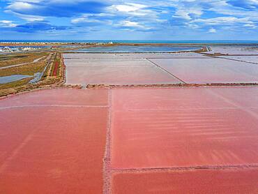 Salt production of Salins du Midi at  Gruissan in Languedoc-Roussillon, France, Aude, Gruissan. Solar evaporaton salt pans salins. salt marshes, saline of Gruissan in aerial view.