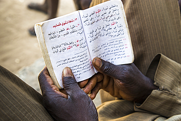 Man reading the Koran