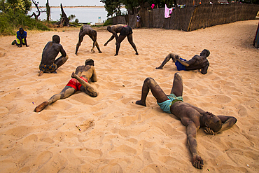 Wrestlers play Senegalese wrestling in Simal