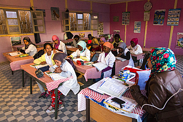 Inside the school with pupils and teacher in Merzouga