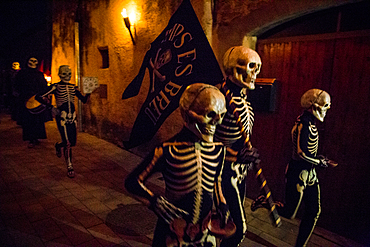 Verges, a small town in the Northeast of Catalonia (Spain), during Easter celebrates the Procession of Verges with skeletons dancing on the sound of a drum, Roman soldiers, known as the 'Manages', and a representation of the life and crucifixion of Jesus Christ. The Procession features the Dance of Death, a tradition from the Middle Age associated with epidemics and plagues and the only one remaining in Spain Ten skeletons dance to the beat of a drum to remember that no one is exempt of death. The backdrop of the medieval walls and towers of Verges is key to this macabre staging.