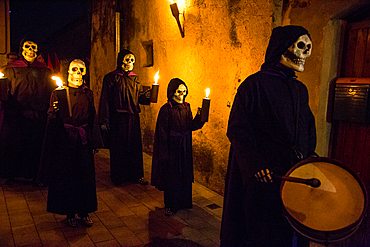 Verges, a small town in the Northeast of Catalonia (Spain), during Easter celebrates the Procession of Verges with skeletons dancing on the sound of a drum, Roman soldiers, known as the 'Manages', and a representation of the life and crucifixion of Jesus Christ. The Procession features the Dance of Death, a tradition from the Middle Age associated with epidemics and plagues and the only one remaining in Spain Ten skeletons dance to the beat of a drum to remember that no one is exempt of death. The backdrop of the medieval walls and towers of Verges is key to this macabre staging.