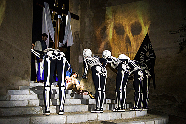 Verges, a small town in the Northeast of Catalonia (Spain), during Easter celebrates the Procession of Verges with skeletons dancing on the sound of a drum, Roman soldiers, known as the 'Manages', and a representation of the life and crucifixion of Jesus Christ. The Procession features the Dance of Death, a tradition from the Middle Age associated with epidemics and plagues and the only one remaining in Spain Ten skeletons dance to the beat of a drum to remember that no one is exempt of death. The backdrop of the medieval walls and towers of Verges is key to this macabre staging.