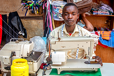 Man with sewing machine Kimironko Market, Kigali Rwanda