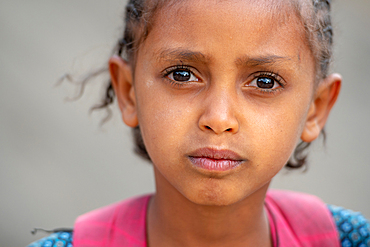 Portrait of a young Ethiopian schoolgirl, Lalibela, Ethiopia.