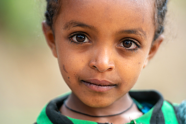 Portrait of a young Ethiopian schoolgirl, Lalibela, Ethiopia.