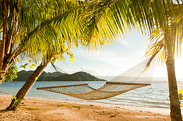 Hammock on beach at Matangi Private Island Resort, Fiji.