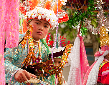 Procession and ceremony for young boys about to become novice monks by the Shan people of Burma at Wat Khun Thwong Buddhist temple in Chiang Mai, Thailand.