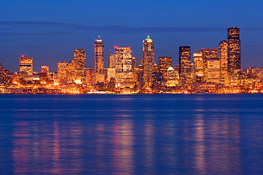 Downtown Seattle, Washington city skyline at dusk from Alki Beach.