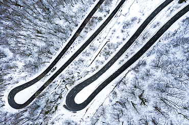 Snow-covered road. Olazagutia pass. Urbasa mountain range. Navarre, Spain, Europe