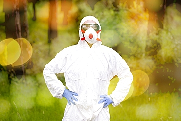 Person with a safety suit in a forest area. Ayegui, Navarre, Spain, Europe