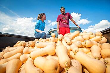 Students standing in a truck filled with gourds in Upper Marlboro, Maryland, USA