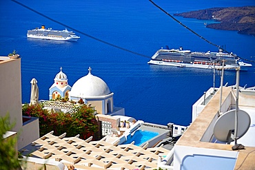 Building roofs and cruise ships in Fira, Santorini, Greek Islands, Greece