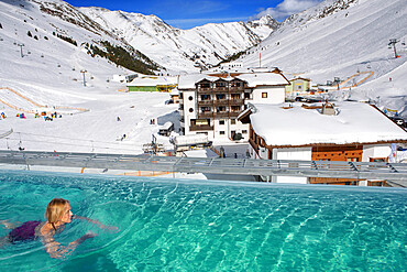 Kuhtai sky resort village and ski slopes near Innsbruck Tyrol Austria. Swimming pool of the Mooshaus Hotel.