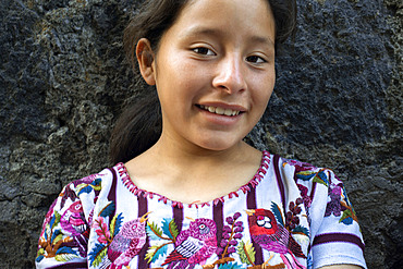 A gir Tzutujil dressed in traditional costume, San Juan de la Laguna, Solol√°, Guatemala.