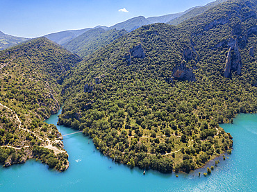 Congost de Mont-Rebei in the Pre-Pyrenees of Lleida, Catalonia. Serra del Montsec, La Noguera, Lleida, Spain

The Montrebei Gorge (in Catalan Congost de Mont-Rebei) is a place that is located between the provinces of Huesca and Lv©rida (Spain), between the regions of Ribagorza and Pallars JussvÜ. It is constituted in the narrowest part by which the Noguera Ribagorzana river, which constitutes the natural border between Aragon and Catalonia, crosses the Montsec mountain range, walls in vertical fall of more than 500 meters and a width at its minimum point of 20 meters . The Catalan part is part of the Noguera Nature Reserve. It is within the Sierra del Montsec Natural Interest Area.