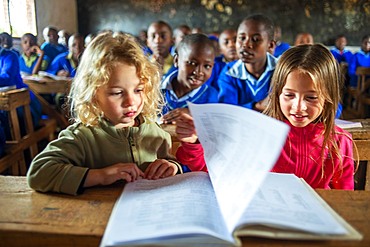 European blonde girls inside Inside primary and second school in a small village near Kitui city in the Kamba country in Kenya, Africa.