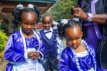 Rich family dressed to go to Christian sunday mass in a small village near Kitui in the Kamba country in Kenya, Africa.