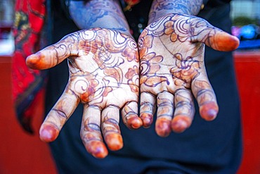 Woman shows Hand Palm Painted With Henna And Indigo in Lamu, Lamu Archipelago, Kenya