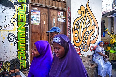 Local people small shops and houses and narrow strees of the city town of Lamu in Kenya