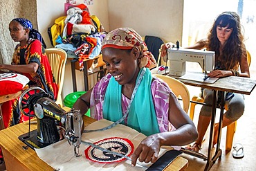 Sewing cloths to make souvenirs. Afrikable spanish NGO in Lamu island Kenya. This association tries to empower women who have been victims of abuse. By making souvenirs that are later sold in the village store and the schooling of their children.