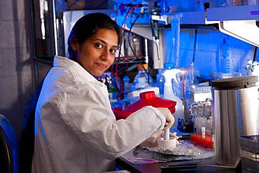 Scientist conducting experiment in lab