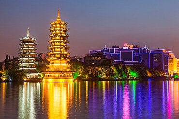 The Sun and Moon Pagodas in the center of Shanu or Fir Lake in the city of Guilin, China.