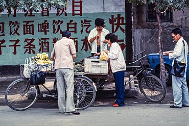 Vendors sellling produce on the street in Beijing, China.