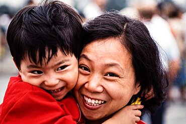 A Chinese mother and her young son pose for a portait in Beijing, China.