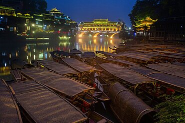 The Phoenix Hong or Hongqiao Bridge and coverd boats on the Tuojing River, Fenghuang, China.