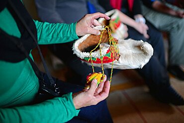 Traditional furry S?mi handmade shoes. Inside the home of Tuula Airamo, a S?mi descendant, and Reindeer farmer, by Muttus Lake. Inari, Lapland, Finland