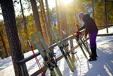 Young woman practicing Altai Skiing in Pyha ski resort, Lapland, Finland