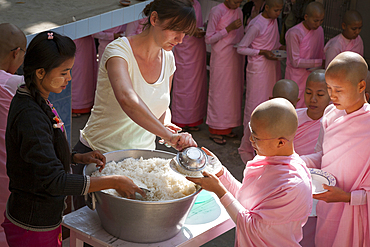 Nuns queuing for a meal, Sakyadhita Thilashin Nunnery School, Sagaing, near Mandalay, Myanmar, (Burma)