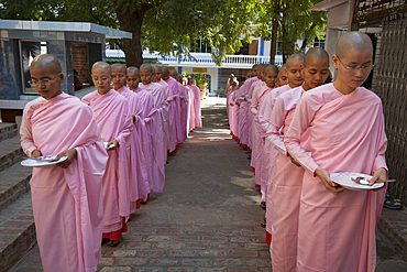 Nuns queuing for a meal, Sakyadhita Thilashin Nunnery School, Sagaing, near Mandalay, Myanmar, (Burma)