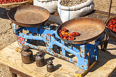 Old weighing scales and weights in an outdoor market, near Samarkand, Uzbekistan