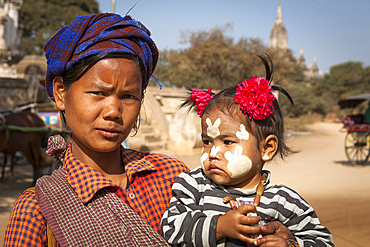 Woman holding a small child, Bagan, Myanmar, (Burma)