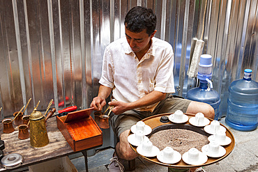 Man making fresh coffee in a street, Beyoglu, Istanbul, Turkey