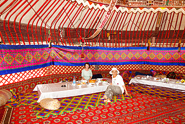 Tourists dining in a yurt, Ayaz Kala Yurt Camp, Ayaz Kala, Khorezm, Uzbekistan