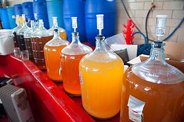 Apples, apple juice and cider press at a hard cider distillery