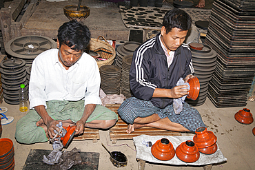 Men working in the U Ba Nyein lacquer ware factory, Myo Thit, Bagan, Myanmar, (Burma)